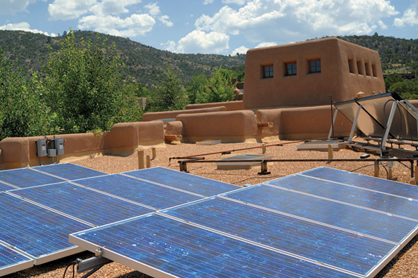 This home's grid-tied solar energy system allows the homeowner's neighbors to use their electric surplus.